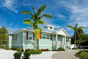 metal roofing on beach home with palm trees